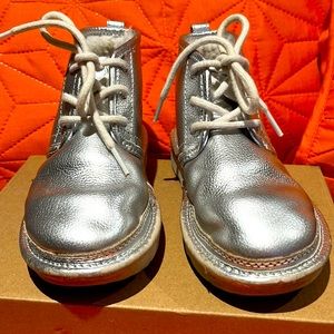 Size 13 Silver UGG furry like new. Only worn a few time. Has minor scuffs.